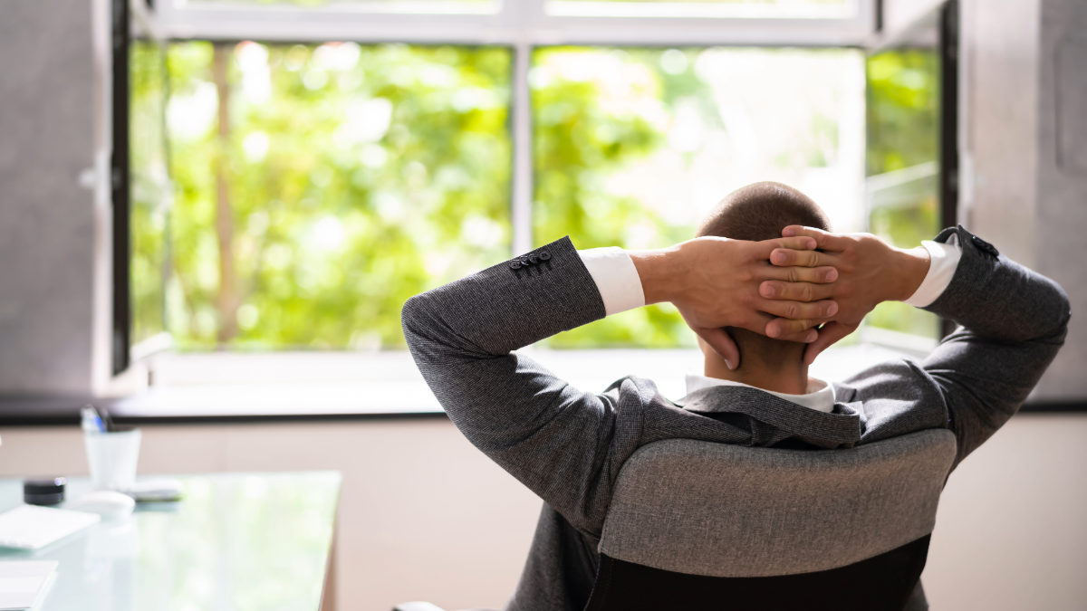 a man in a well ventilated office enjoying high quality indoor air